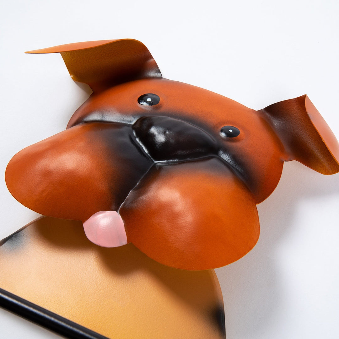 Sea Dragon Dreams metal dog toilet paper holder with a playful brown boxer-style face and pink tongue.