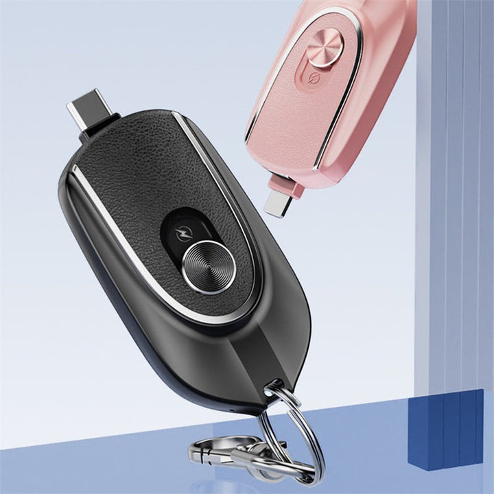 Sea Dragon Dreams 2-in-1 mini keychain power banks in black and pink with retractable connectors and carabiner clips.