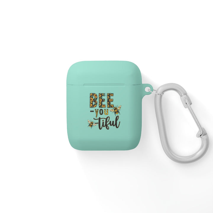 Sea Dragon Dreams mint green TPU AirPods case with Bee-You-Tiful floral bee print and a silver metal carabiner.