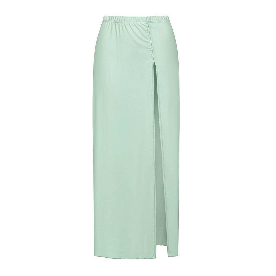 Sea Dragon Dreams mint green maxi skirt with a high front slit, made from soft, stretchy fabric for resort wear.
