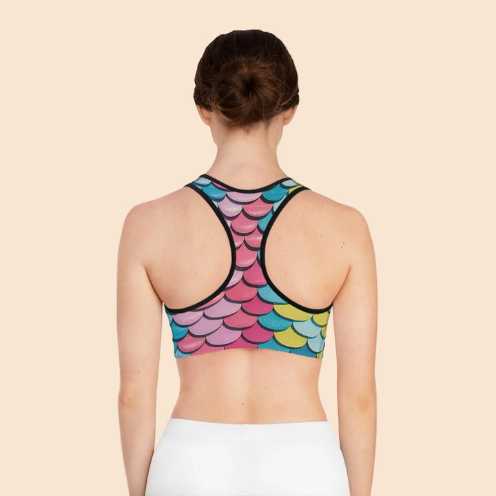 Sea Dragon Dreams MNMS seamless racerback sports bra with a colourful mermaid scale print on a woman from behind.