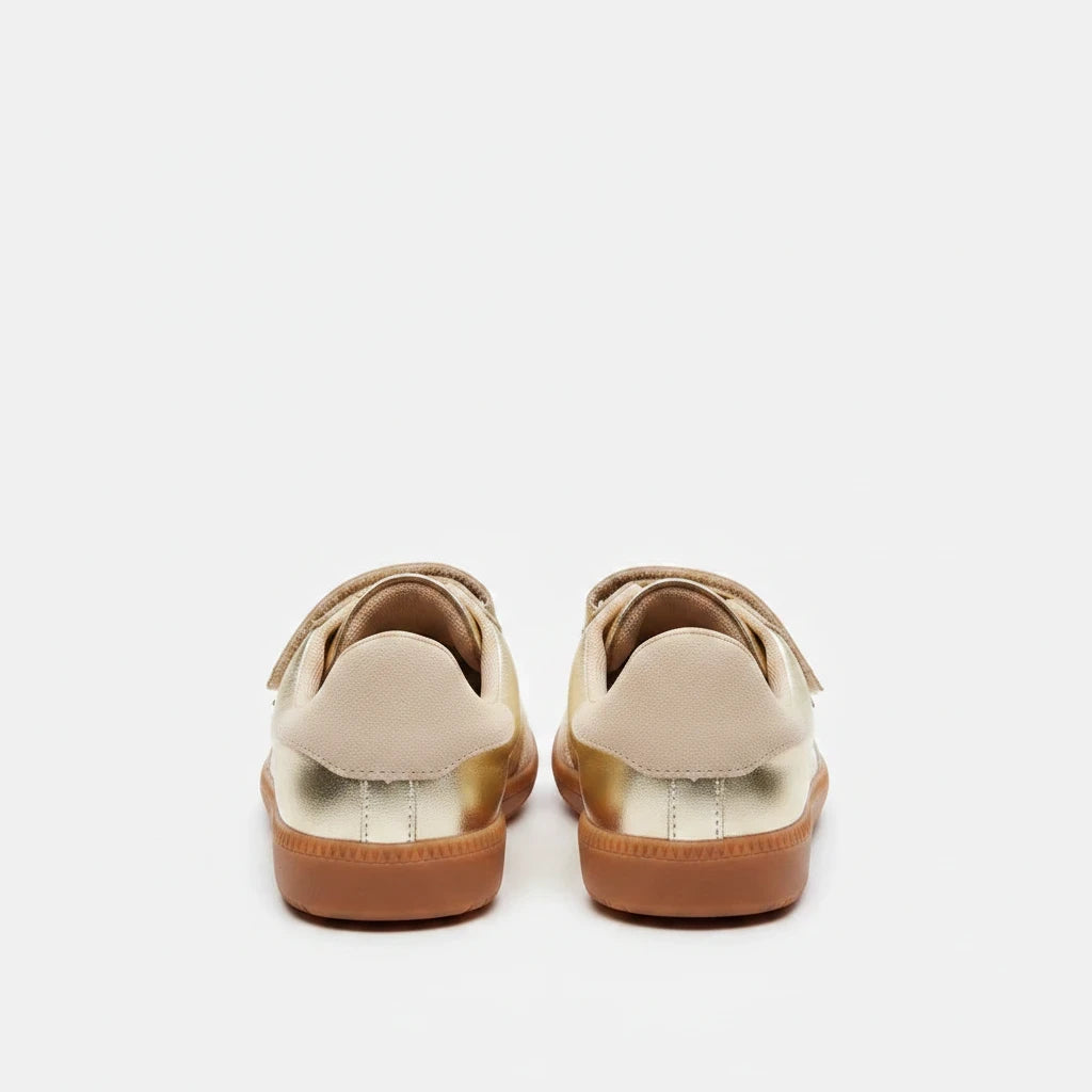 Sea Dragon Dreams Steve Madden Momentum gold metallic vegan leather sneakers, back view showing gum soles.