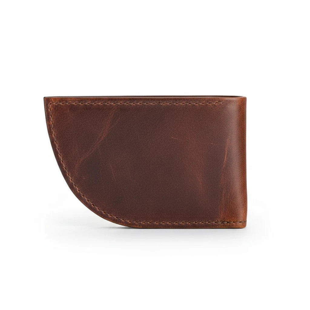 Sea Dragon Dreams Nantucket moose leather front pocket wallet in brown with a unique curved whale-tail shape.