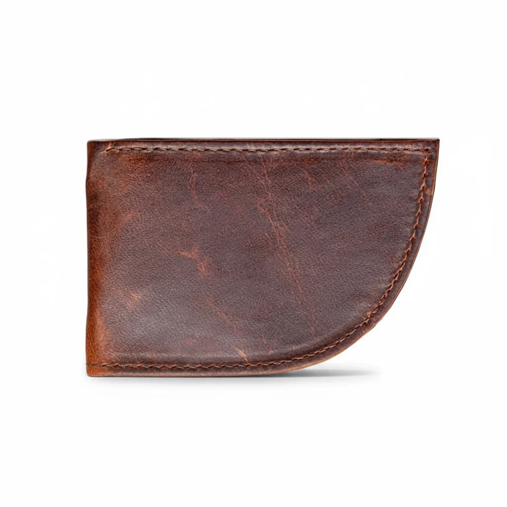 Sea Dragon Dreams Nantucket moose leather front pocket wallet in a dark brown, curved whale-tail inspired shape.