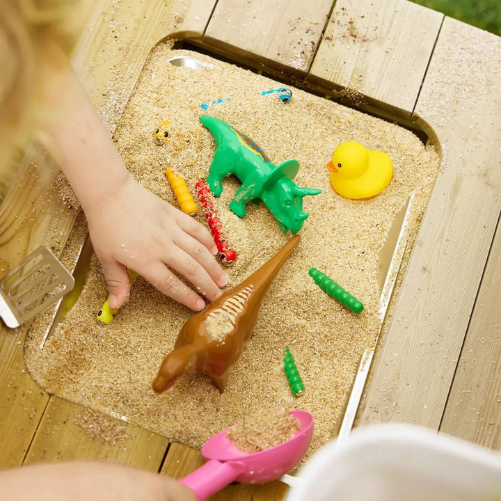 Sea Dragon Dreams Tiny Land mud kitchen sensory basin with sand, toy dinosaurs, and a rubber duck for outdoor play