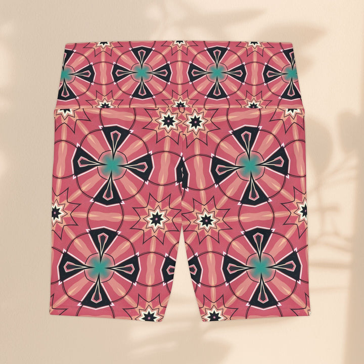 Sea Dragon Dreams Mystic Circles workout shorts in pink with a vibrant floral and geometric pattern.