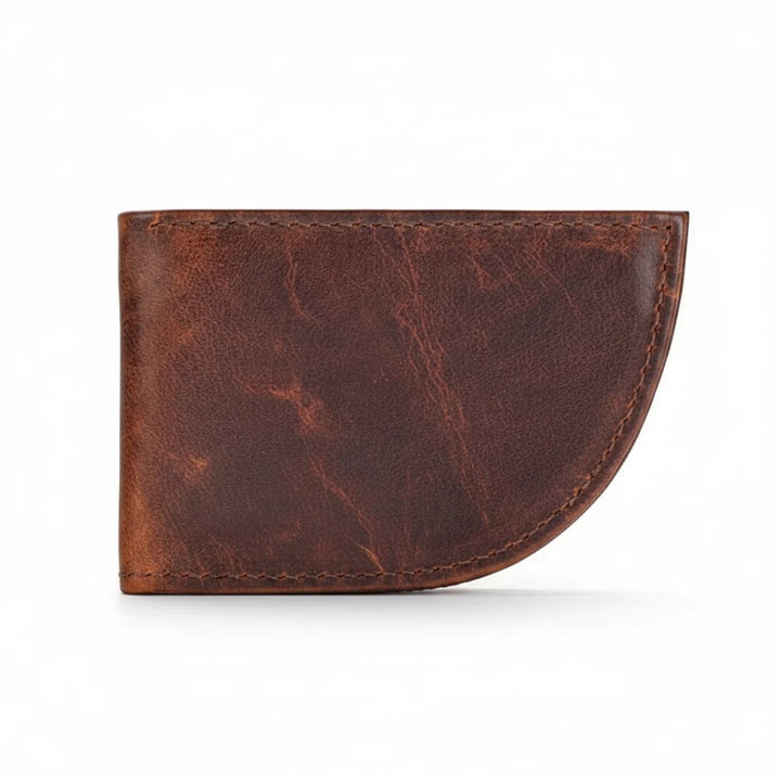 Sea Dragon Dreams Nantucket moose leather front pocket wallet in brown with a unique curved whale-tail shape.
