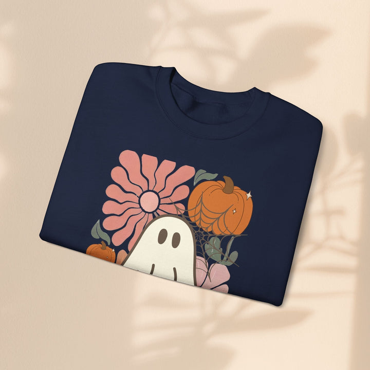Sea Dragon Dreams navy crewneck sweatshirt with a retro ghost, pumpkin, and flower graphic print.