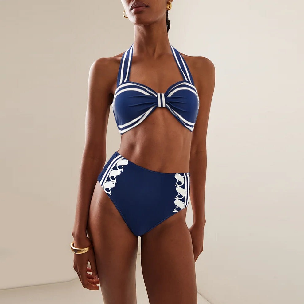 Sea Dragon Dreams navy blue halter bikini with white stripes and whale print on high-waisted bottoms