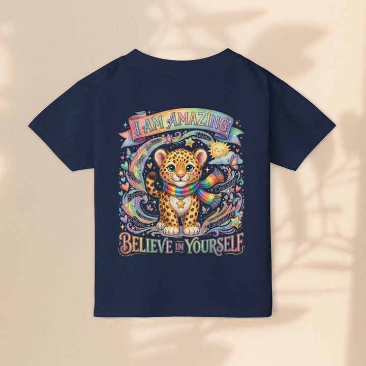 Sea Dragon Dreams navy toddler t-shirt featuring a cute leopard, rainbow scarf, and I Am Amazing affirmation graphic.