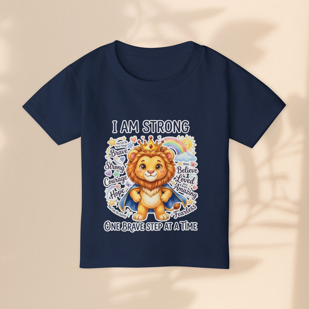 Sea Dragon Dreams toddler t-shirt in navy blue cotton featuring a courageous lion graphic and I Am Strong text.