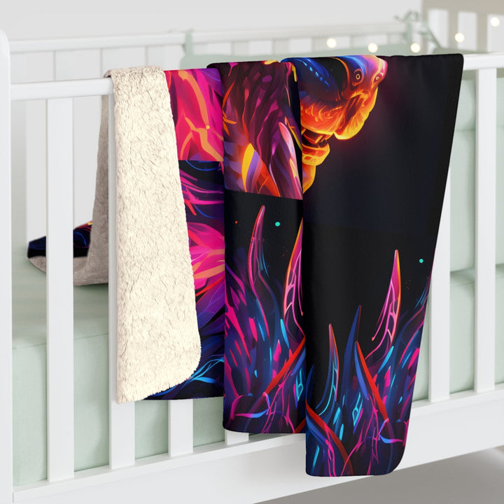 Sea Dragon Dreams neon dragon sherpa fleece blanket with vibrant fantasy art and soft white plush lining on a crib.