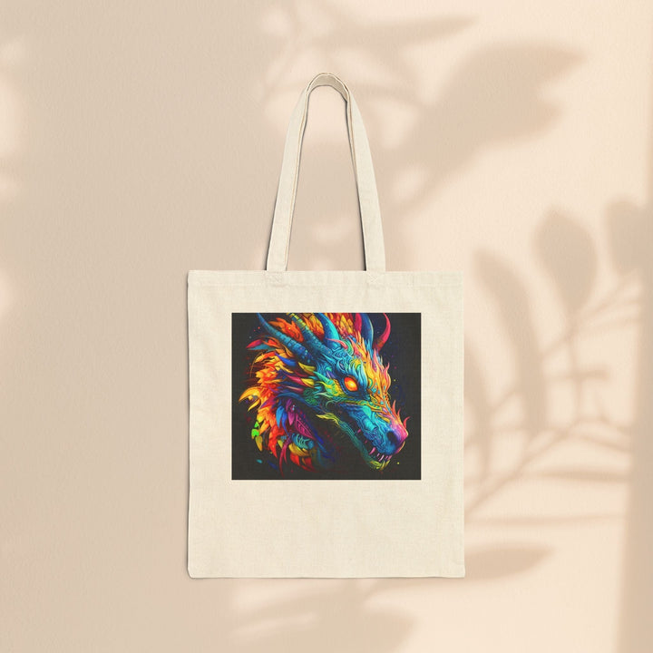 Sea Dragon Dreams cotton canvas tote bag featuring a vibrant neon dragon illustration on a natural beige background.