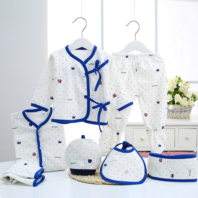 Sea Dragon Dreams newborn baby cotton clothing set featuring white fabric with blue crown patterns and trim