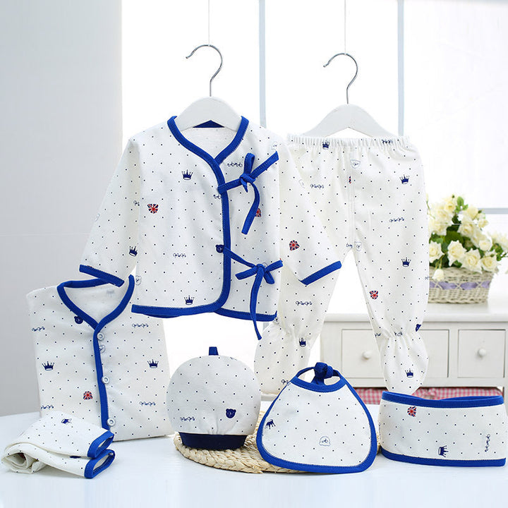 Sea Dragon Dreams newborn baby cotton clothing set featuring white fabric with blue crown patterns and trim