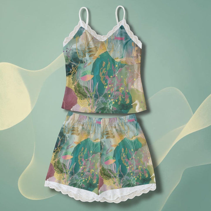 Sea Dragon Dreams women's pajama set with ocean-themed print, camisole top, and shorts featuring delicate lace trim.