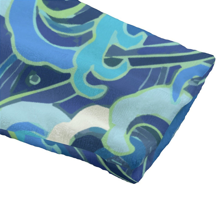 Sea Dragon Dreams unisex flannel hooded bathrobe featuring a soft, plush blue and green ocean wave pattern.