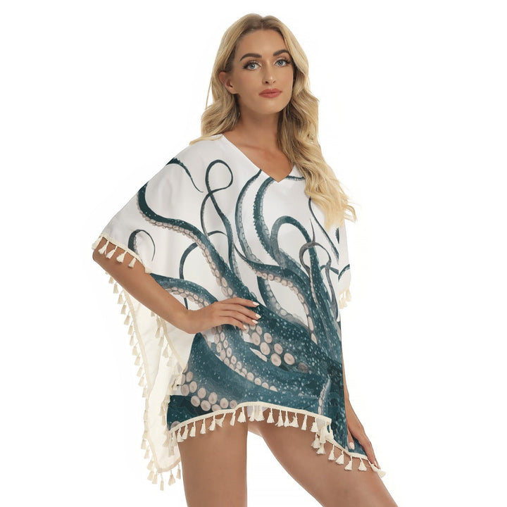 Sea Dragon Dreams square fringed shawl cover-up with a teal octopus print on white polyester fabric, worn by a model.