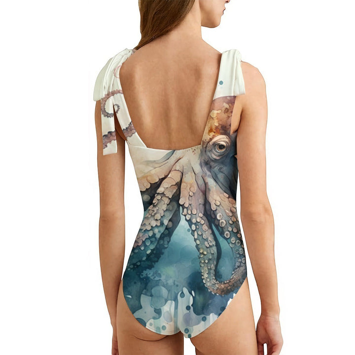 Sea Dragon Dreams women's one-piece swimsuit featuring a detailed octopus print, adjustable shoulder ties, and back view.