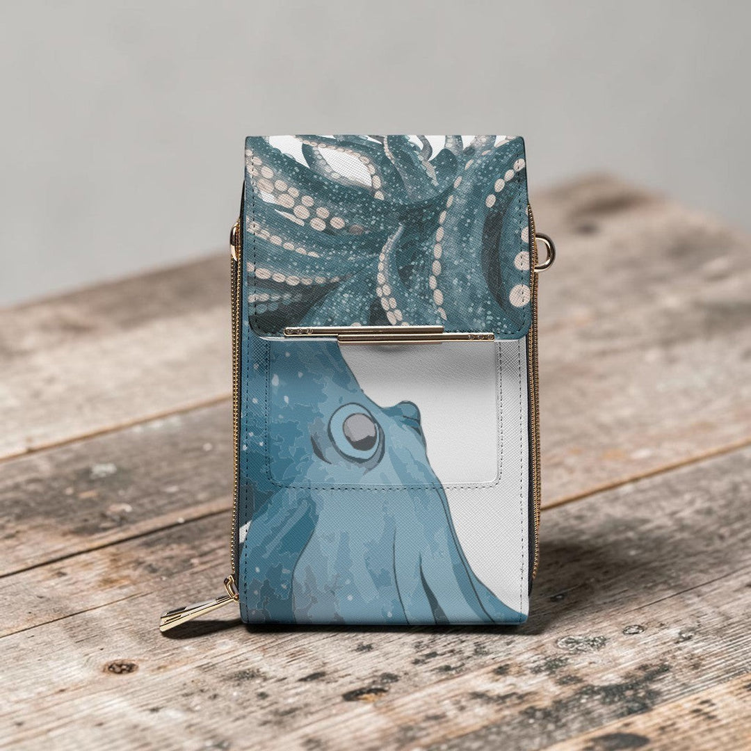 Sea Dragon Dreams octopus print PU leather mobile phone chest bag with a smooth texture on a rustic wooden surface.