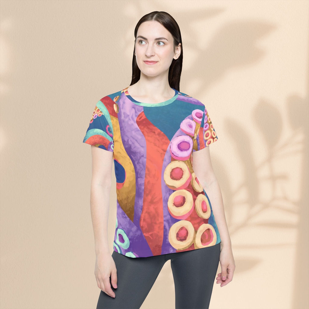 Sea Dragon Dreams women's sports jersey featuring a vibrant, abstract octopus tentacle pattern in multi-colored hues.