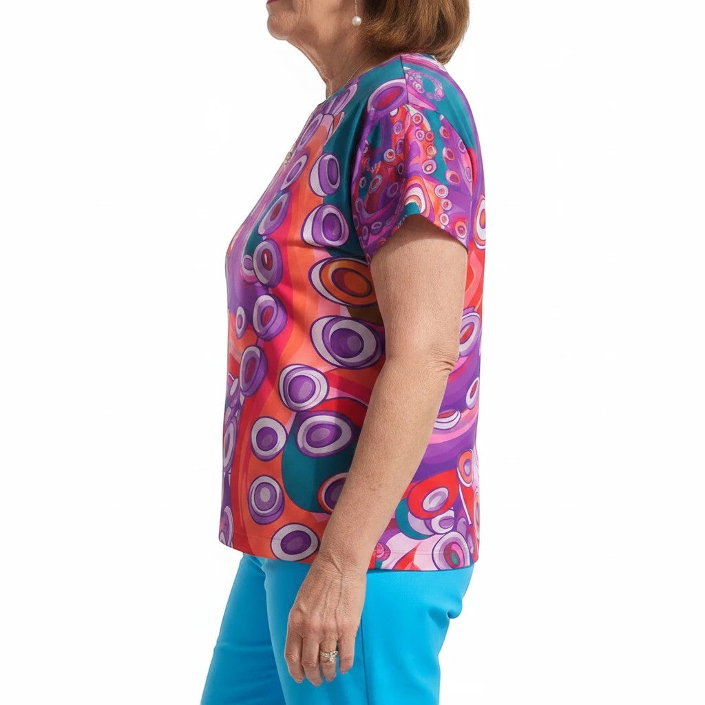 Sea Dragon Dreams women's sports jersey featuring a vibrant, artistic octopus-inspired pattern in purple, red, and teal.