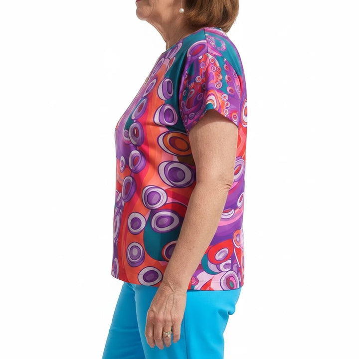 Sea Dragon Dreams women's sports jersey featuring a vibrant, artistic octopus-inspired pattern in purple, red, and teal.