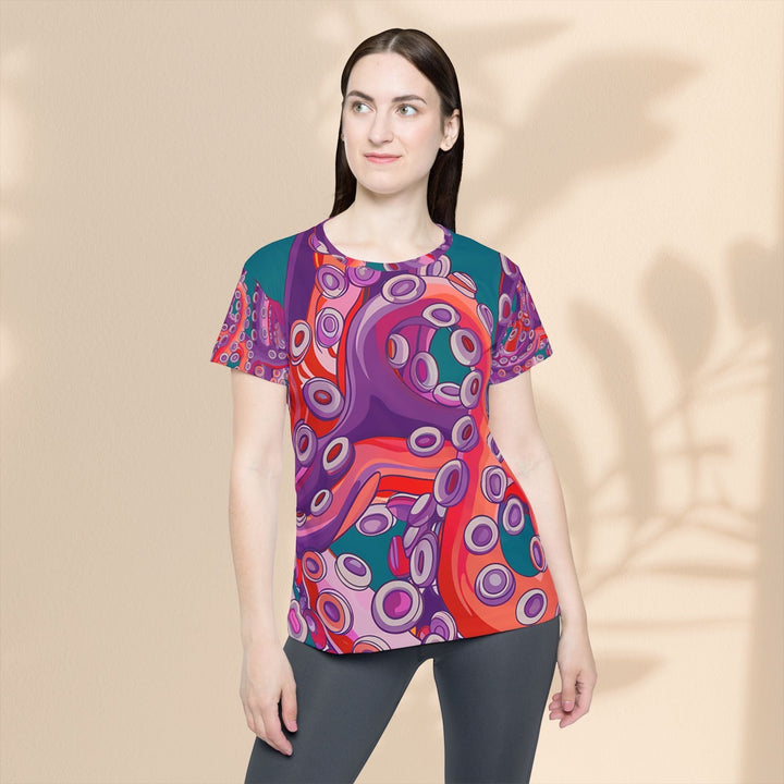 Sea Dragon Dreams women's sports jersey featuring a vibrant, artistic octopus pattern in shades of purple, red, and teal.