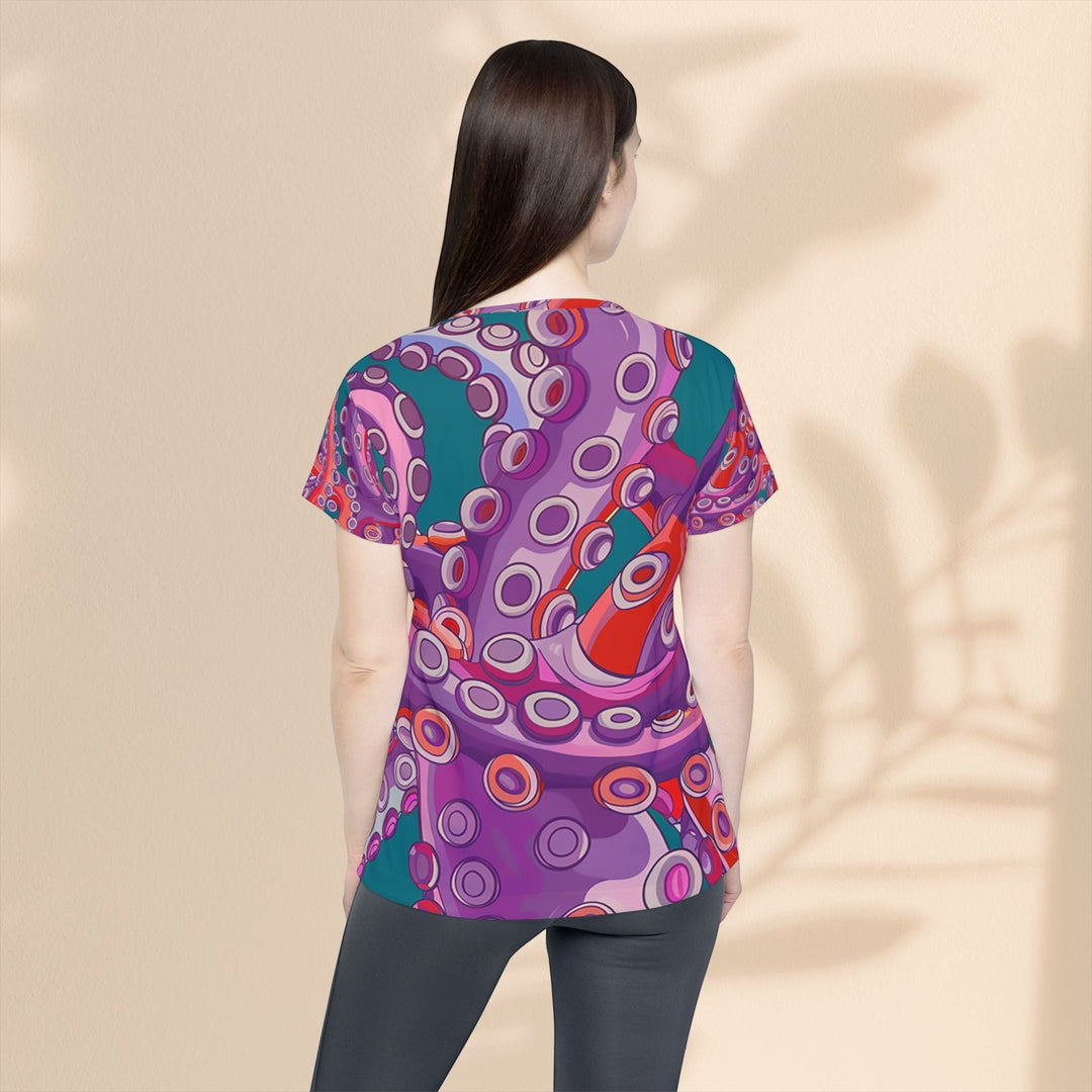 Sea Dragon Dreams women's sports jersey featuring a vibrant purple and teal artistic octopus tentacle pattern
