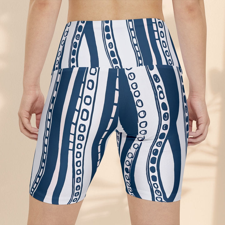 Sea Dragon Dreams women's workout shorts with a blue and white octopus tentacle print, back view.
