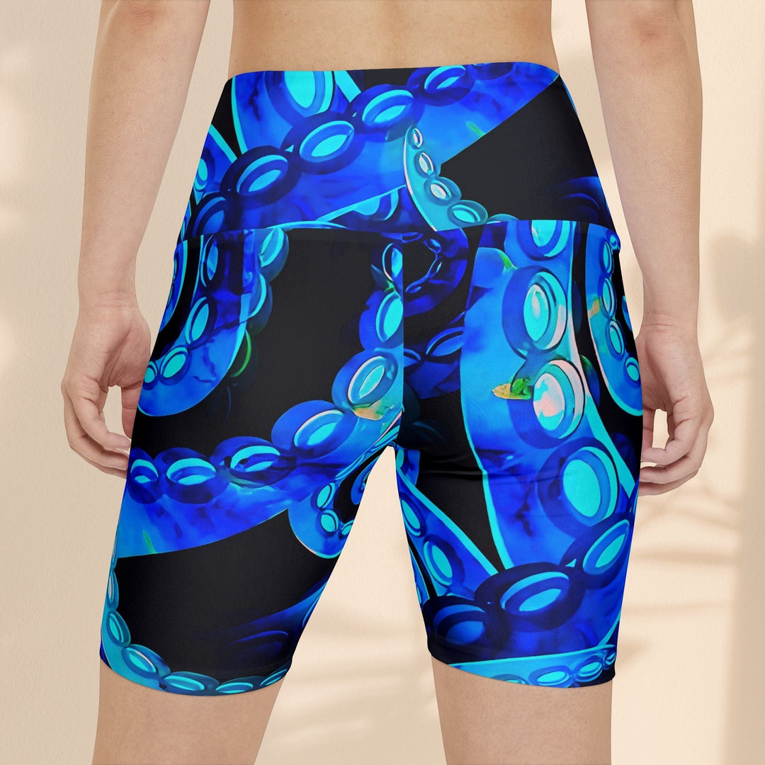 Sea Dragon Dreams Octopus Delight workout shorts featuring a vibrant blue octopus tentacle print on black polyester.