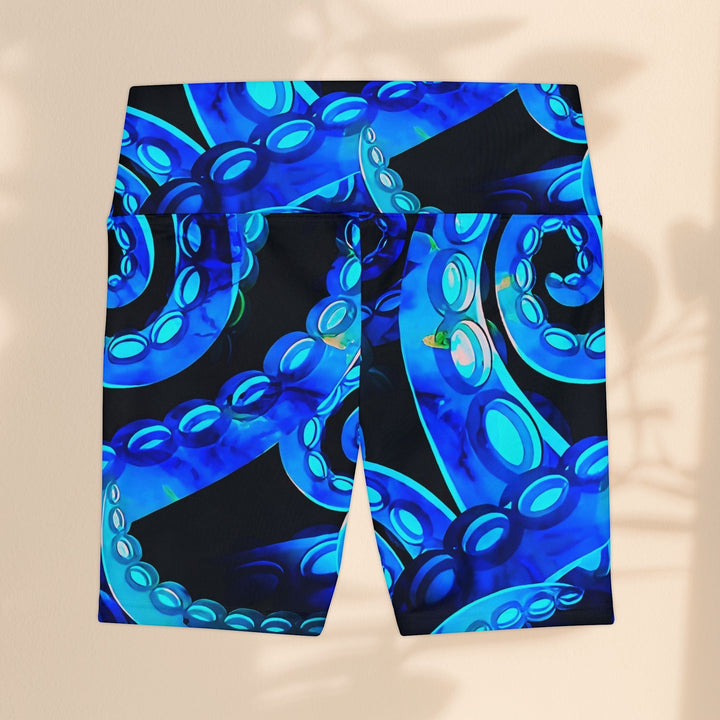 Sea Dragon Dreams Octopus Delight workout shorts in blue with a vibrant octopus tentacle print on black polyester.