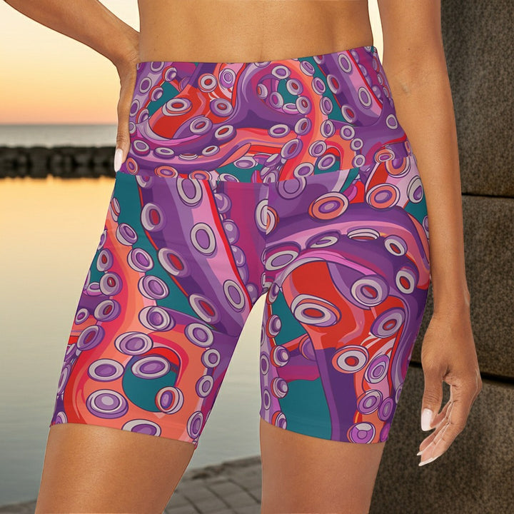 Sea Dragon Dreams high waisted yoga shorts featuring a vibrant purple and orange octopus tentacle pattern.