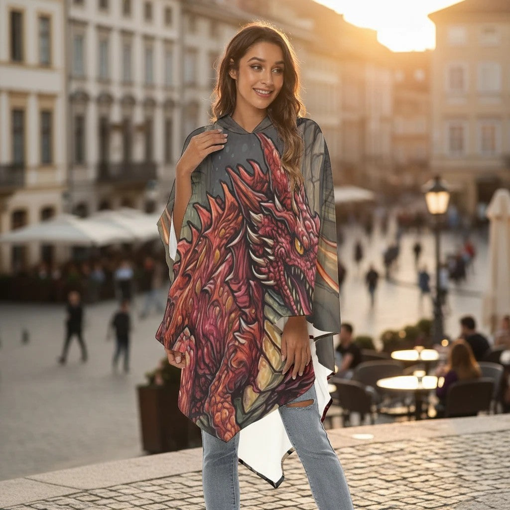 Sea Dragon Dreams unisex hooded cloak featuring a vibrant orange dragon print, worn by a woman in a city square.