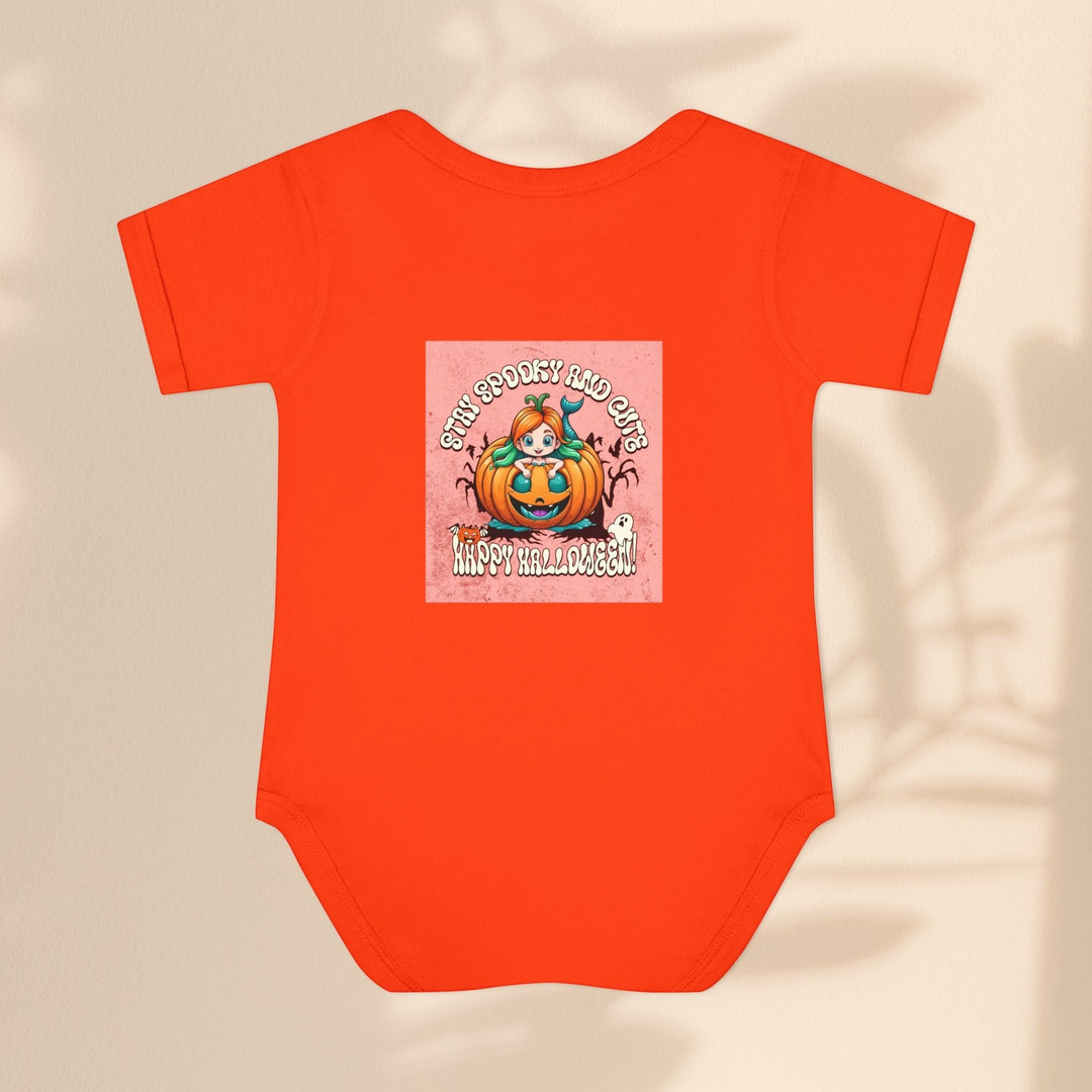 Sea Dragon Dreams infant bodysuit in bright orange with a Stay Spooky and Cute pumpkin Halloween graphic print.