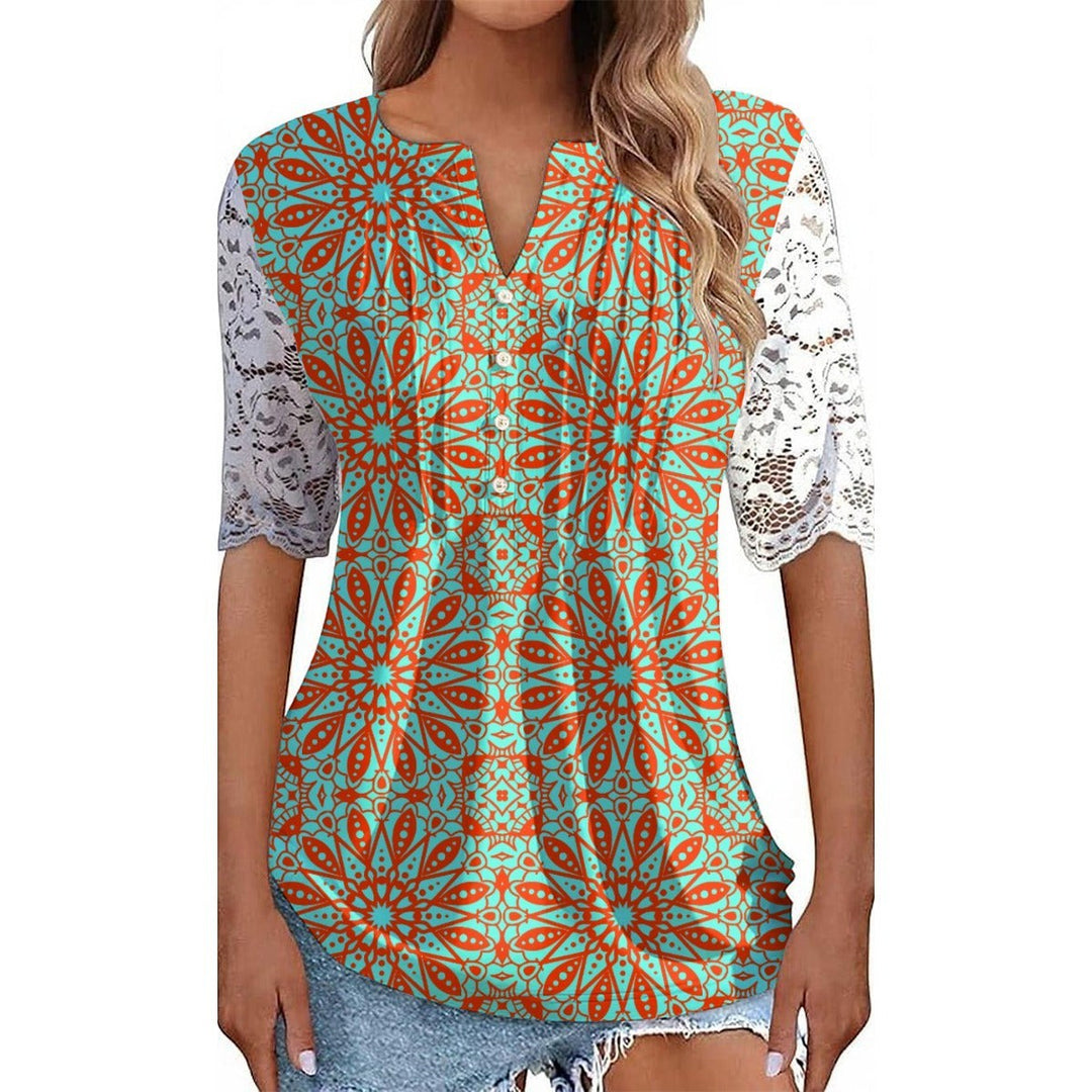 Sea Dragon Dreams orange and teal patterned shirt with delicate white lace sleeves and a V-neckline