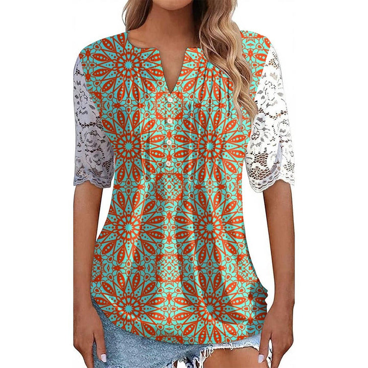 Sea Dragon Dreams orange and teal patterned shirt with delicate white lace sleeves and a V-neckline