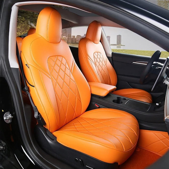 Sea Dragon Dreams orange leather seat covers with diamond-stitched pattern installed in a Tesla Model 3 or Model Y.