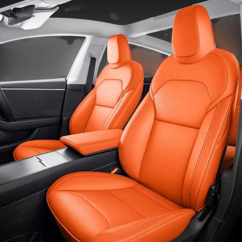Sea Dragon Dreams bright orange leather seat covers installed in a Tesla Model 3 or Model Y interior.