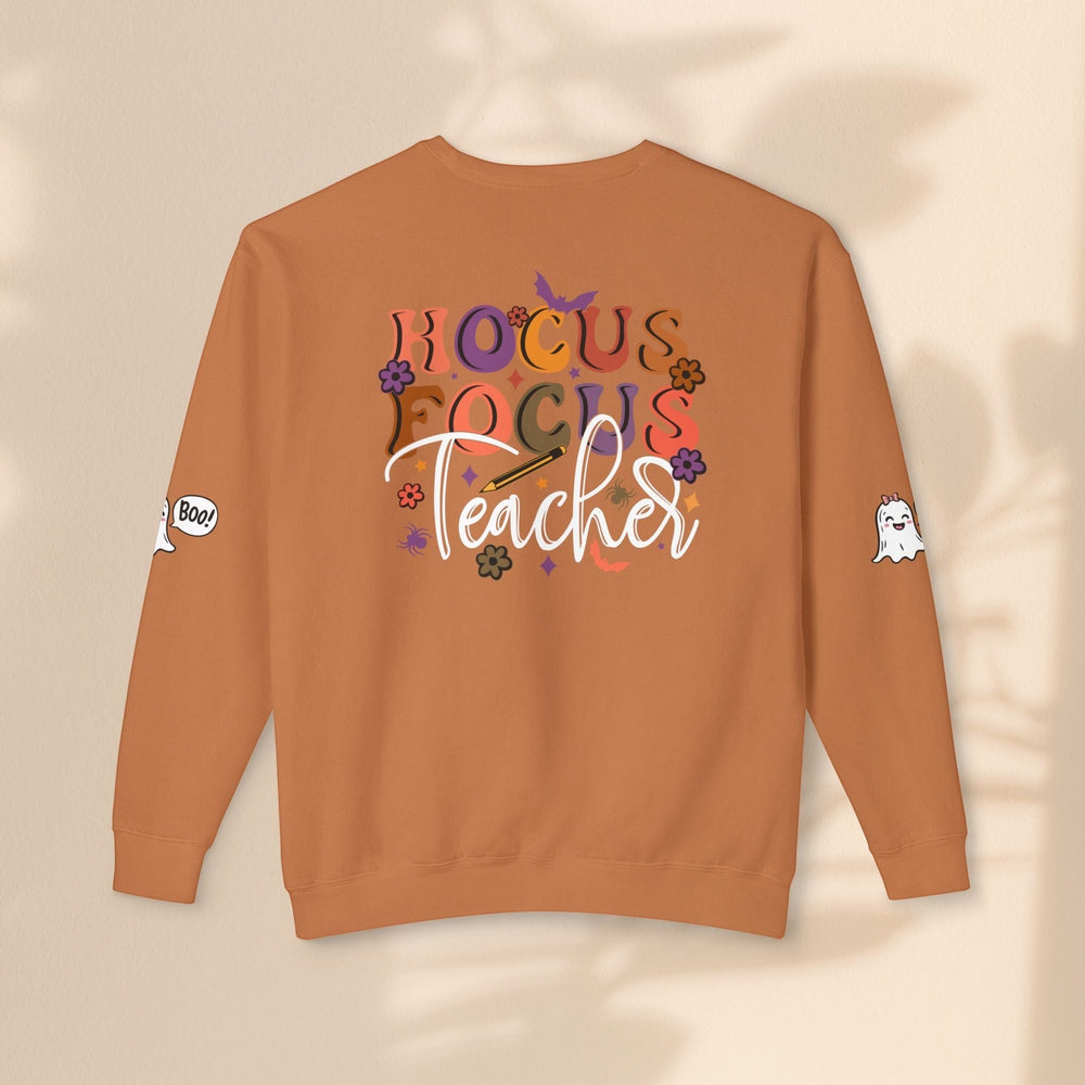 Sea Dragon Dreams unisex orange crewneck sweatshirt with Hocus Focus Teacher graphic and ghost sleeve details.