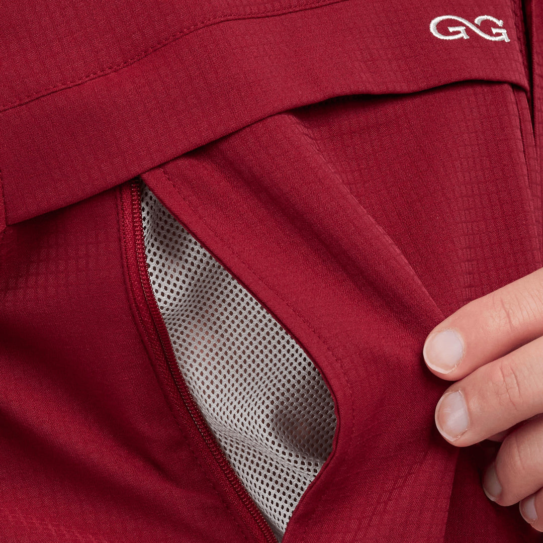 Sea Dragon Dreams oxblood long sleeve scout shirt featuring a zippered chest pocket with mesh ventilation lining.