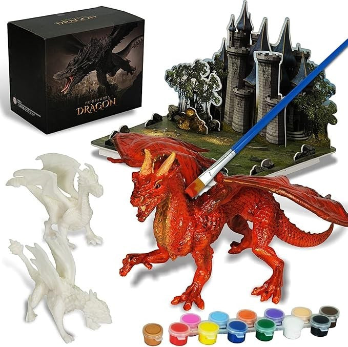 Sea Dragon Dreams dragon painting kit with three figurines, a 3D castle puzzle, paint pots, and a paintbrush.