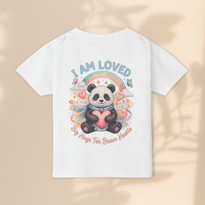 Sea Dragon Dreams white cotton toddler t-shirt featuring a Huggie Panda graphic with a rainbow, heart, and affirmation.