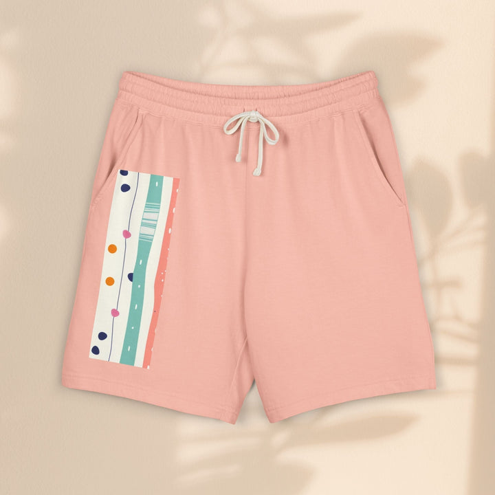 Sea Dragon Dreams pastel pink fleece sweat shorts with a decorative stripe pattern on the side and drawstring waist.