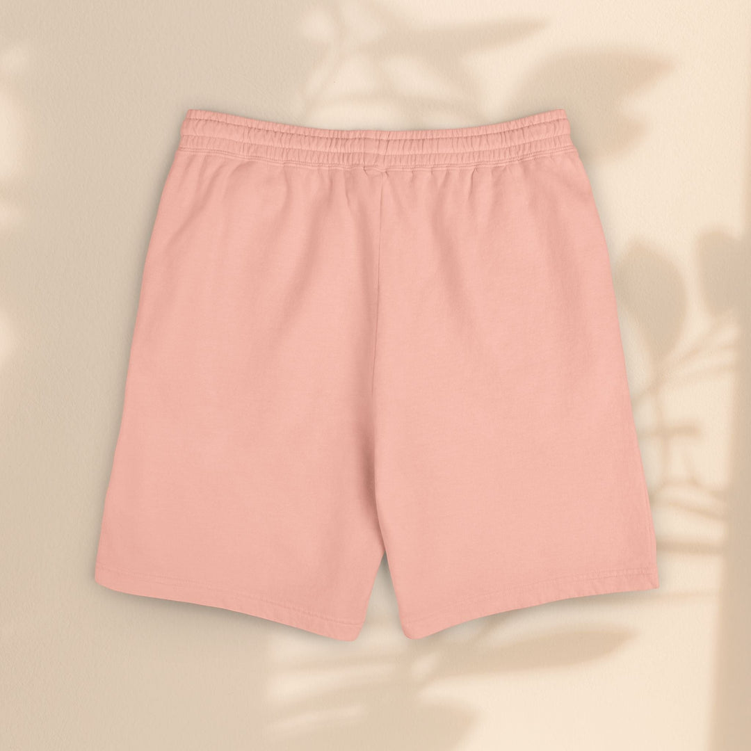 Sea Dragon Dreams pastel pink lightweight fleece sweat shorts with an elastic waistband, shown in a flat lay view.