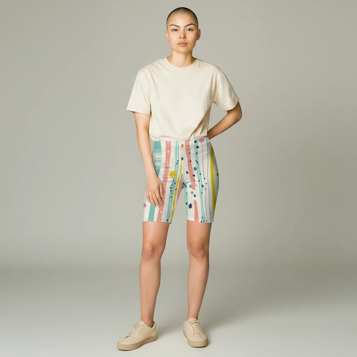 Sea Dragon Dreams high-waisted biker shorts with pastel stripes, polka dots, and brushstrokes on a model.
