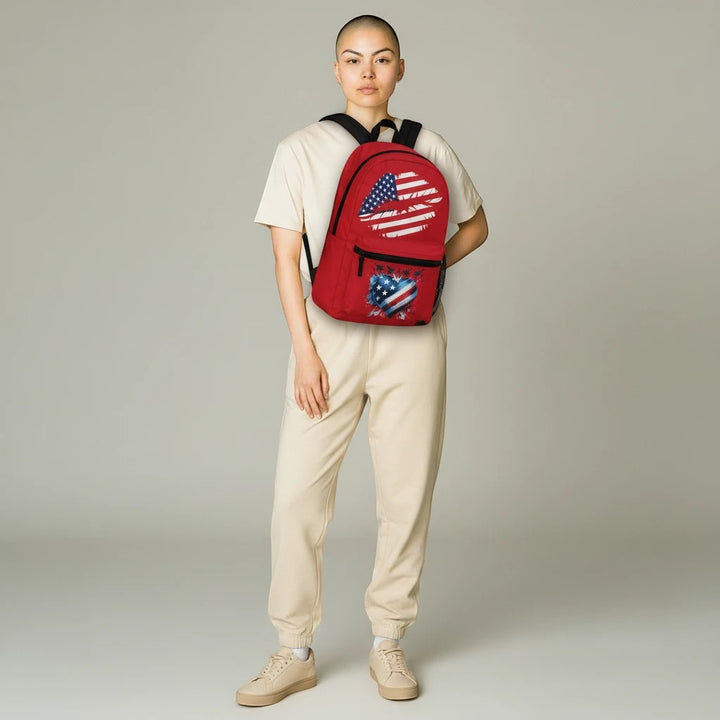 Sea Dragon Dreams patriotic red backpack with USA flag heart design worn by a model in beige loungewear