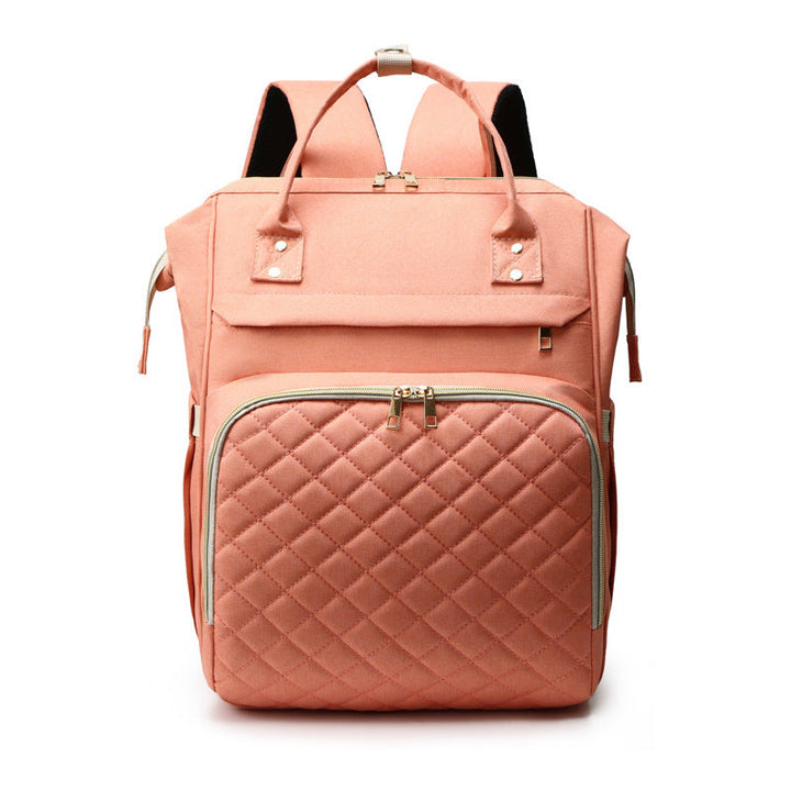 Sea Dragon Dreams large-capacity coral pink quilted diaper backpack with multiple storage compartments