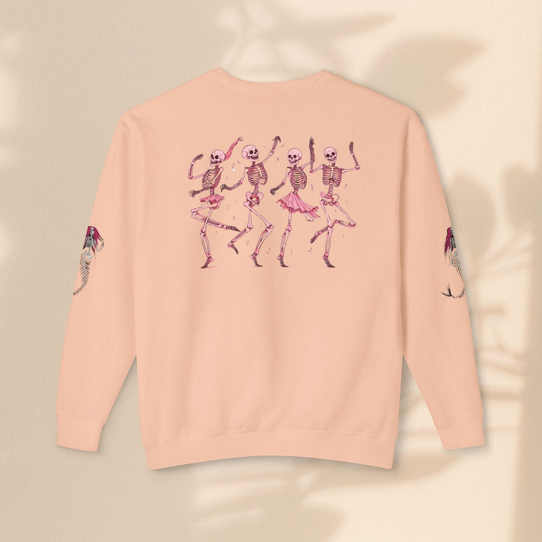 Sea Dragon Dreams peach crewneck sweatshirt with dancing skeletons graphic on back and mermaid art on sleeves.