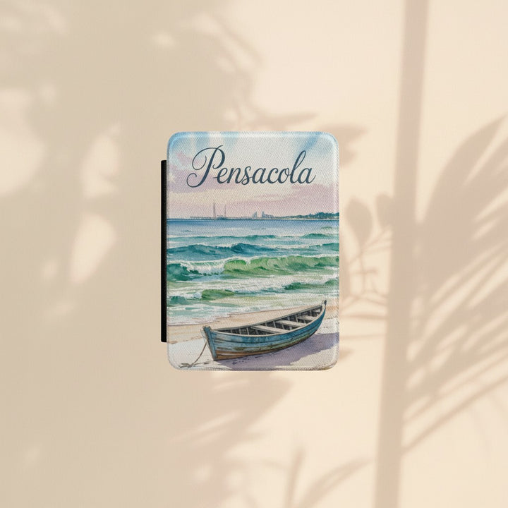 Sea Dragon Dreams Pensacola Beach Kindle Paperwhite case featuring a watercolor boat on a sandy shore with waves.